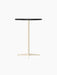 An angled shot of the Nook Bar Table with a round, charcoal linoleum tabletop and a slim, ivory-coloured pedestal base.