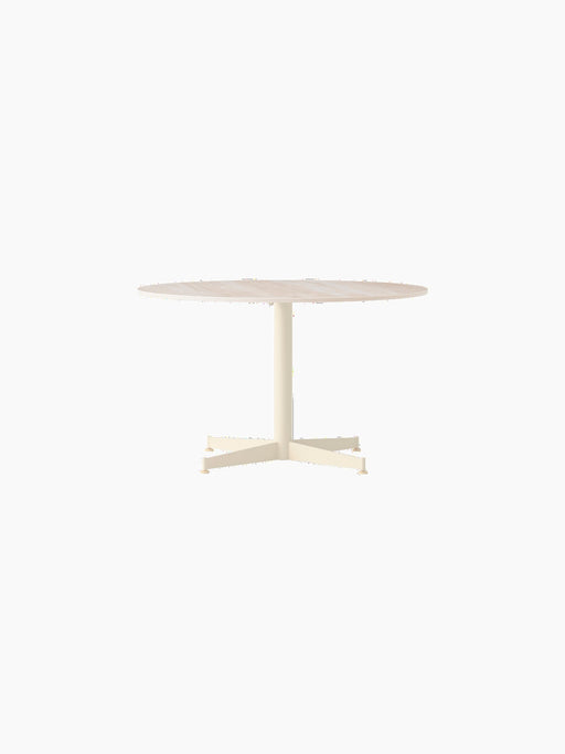 Front view of the Nook Lounge Table with a round Kunis Breccia stone top and a four-star ivory base.