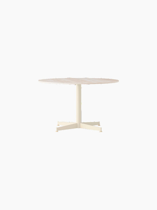 Front view of the Nook Lounge Table with a round Kunis Breccia stone top and a four-star ivory base.