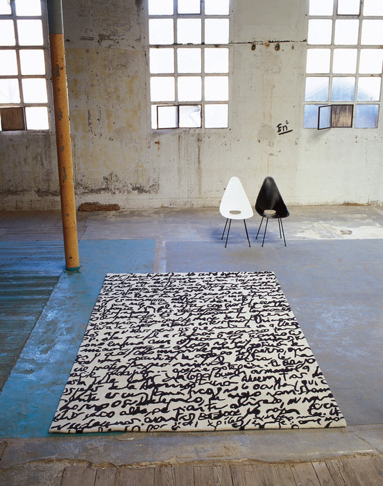 Black on White Manuscrit Rug in interior setting - nanimarquina