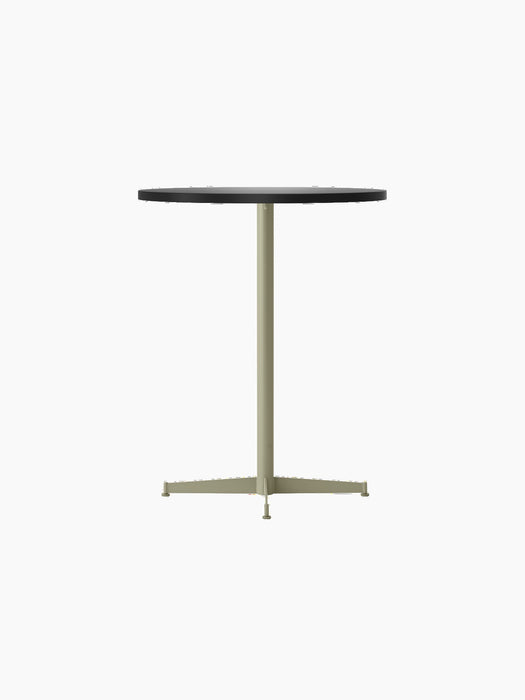 Angled view of the Nook Counter Table with a round charcoal tabletop and a slender pedestal base in an olive finish.