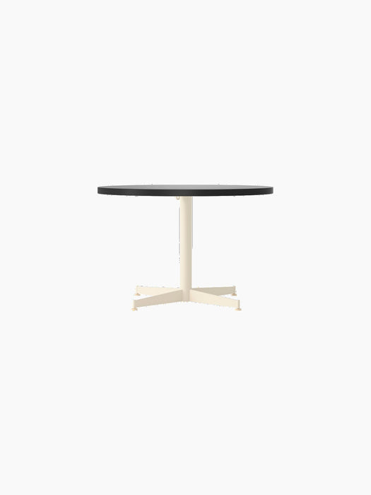Front view of the Nook Lounge Table, featuring a round charcoal linoleum tabletop on a slender ivory stem and four-star base.