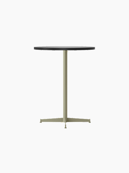 Angled view of the Nook Counter Table, featuring a round Kunis Breccia stone top and a four-pronged olive metal base.