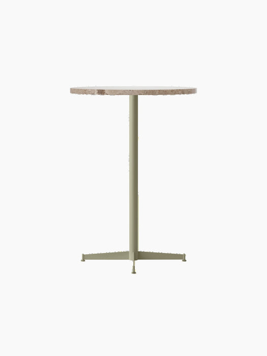 An angled view of the Nook Bar Table with a round Kunis Breccia stone top and an olive-coloured powder-coated steel base.