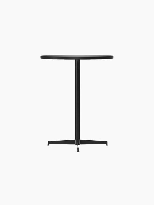 Angled view of the black Nook Counter Table with a round top, central column, and a four-pronged base with adjustable feet.
