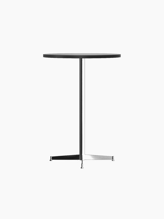 Angled view of the Nook Bar Table with a light round tabletop and a black powder-coated steel base on a black background.