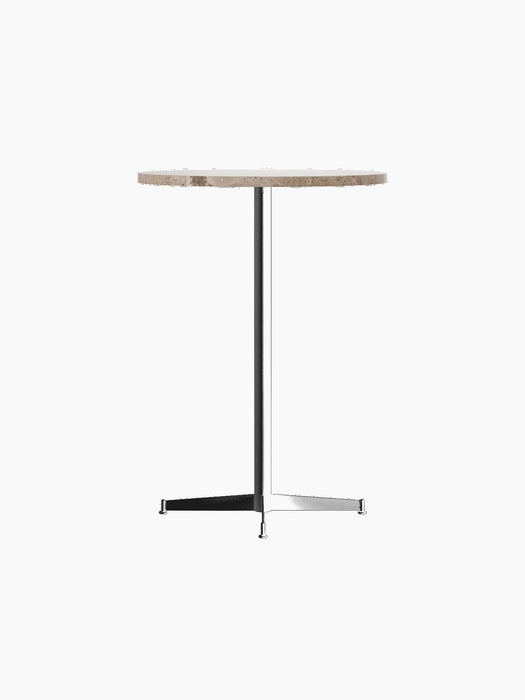 An angled view of the Nook Bar Table, featuring a round, beige Kunis Breccia stone top and a slim black pedestal base.