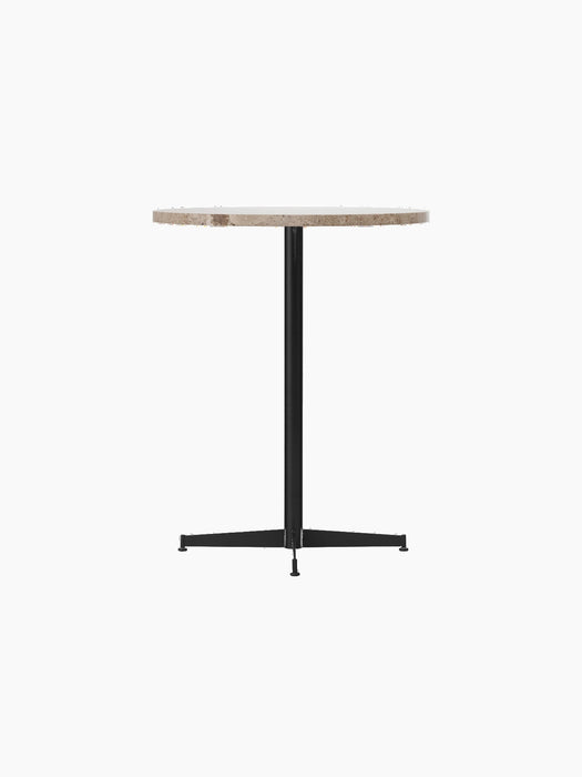 Angled view of the Nook Counter Table featuring a round Kunis Breccia stone top and a slender black powder-coated steel base.