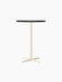 Front view of the Nook Bar Table, featuring a dark, round tabletop on a slender ivory stem and matching four-star base.