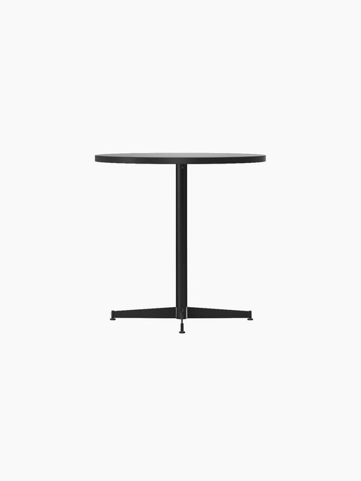 Side view of the Nook Dining Table with a round, light stone tabletop and a slim black central stem on a four-star base.
