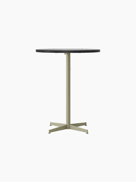 Front view of the Nook Counter Table with a round, light-coloured top and a pale olive-green base on a four-star foot.
