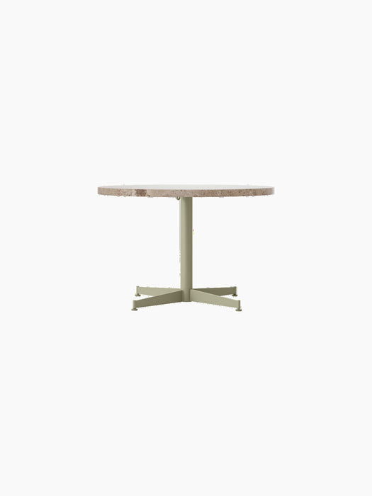 Front view of the Nook Lounge Table, featuring a round Kunis Breccia stone top and a slim, four-star base in an olive finish.