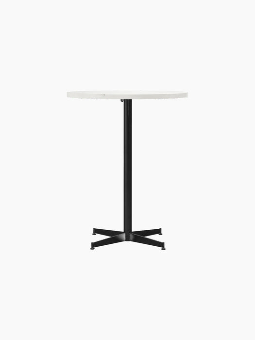 Front view of the Nook Counter Table with a round, white marble top on a slim, black central stem and four-star base.