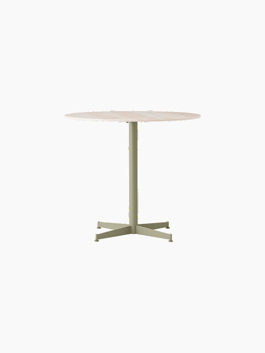 Front view of the Nook Dining Table, featuring a round, light-coloured marble top and a slim, olive-coloured four-star base.