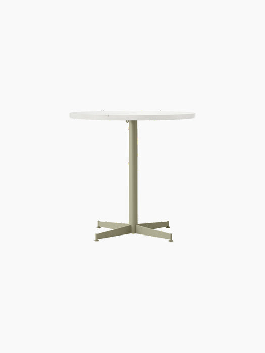 Front view of the Nook Dining Table with a round, white top and an olive-coloured, four-star pedestal base.