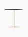 The Nook Bar Table, angled to show its rectangular charcoal linoleum top and slender, four-pronged ivory steel base.