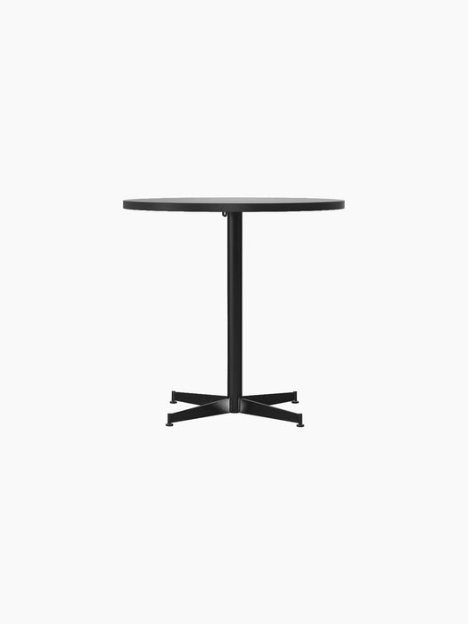 Front view of the Nook Dining Table with a round Estremoz Marble top and a black powder-coated steel four-star base.