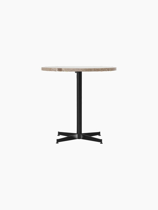 Front view of the Nook Dining Table with a round Kunis Breccia stone top and a black powder-coated steel four-star base.