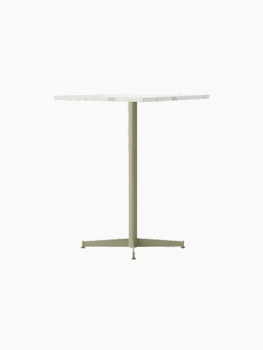 An angle view of the Nook Counter Table, featuring a square white marble top and olive-coloured central pedestal base.
