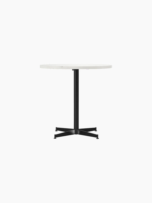 Front view of the Nook Dining Table with a round, white Estremoz Marble top and a black powder-coated steel four-star base.