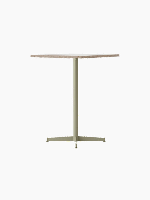 Angled view of the Nook Counter Table, featuring a Kunis Breccia Stone top and a powder-coated steel base in Olive.