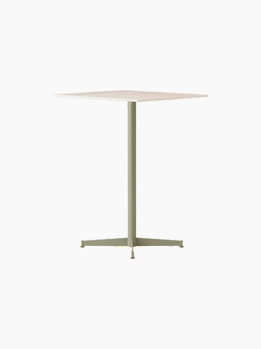 Angled view of the Nook Counter Table, featuring a light-coloured square top and a slender, olive green pedestal base.