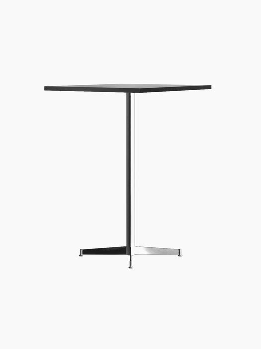 An angled view of the Nook Bar Table, featuring a light-coloured round top and a slim black powder-coated steel base.