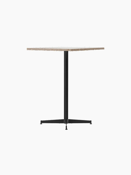 Angle view of the Nook Counter Table, showcasing its textured Kunis Breccia stone top and minimalist black steel central leg.