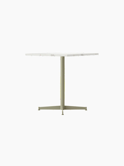 Side view of the Nook Dining Table, featuring a white marble tabletop and a slim, olive powder-coated steel four-star base.