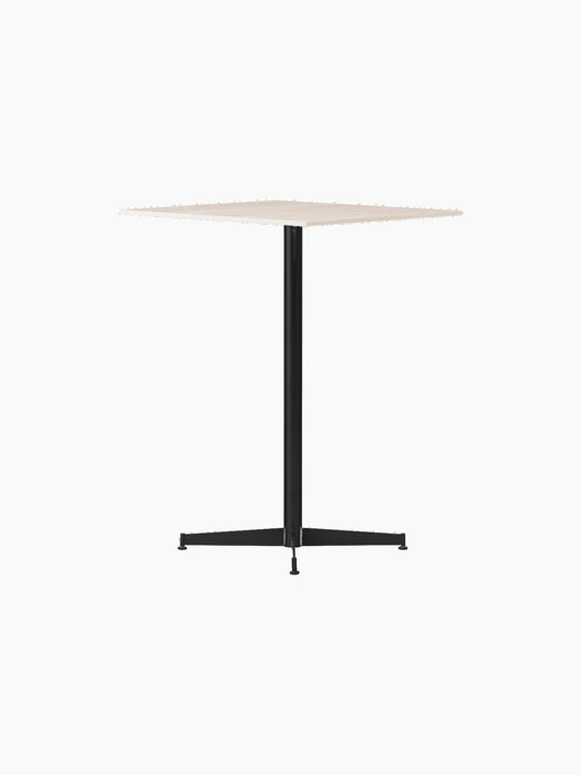 Angled view of the Nook Counter Table with a square, light-coloured top and a black powder-coated steel pedestal base.