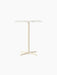 Front view of the Nook Counter Table with a rectangular white marble top and slim ivory pedestal base with four feet.