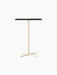 Front view of the Nook Bar Table, with a rectangular dark tabletop and a contrasting ivory, four-pronged steel base.