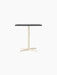 The Nook Dining Table with a rectangular charcoal linoleum tabletop on a slim, ivory, four-star base.