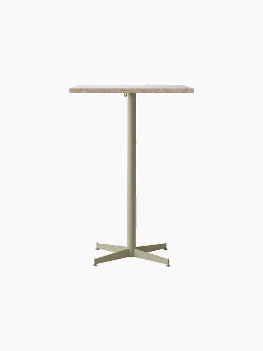A front view of the Nook Bar Table featuring a rectangular Kunis Breccia Stone tabletop on a slim, olive-coloured steel base.