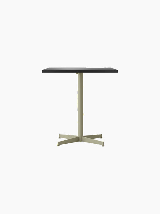Front view of the Nook Dining Table, featuring a rectangular dark top and a slim, olive-coloured four-star pedestal base.