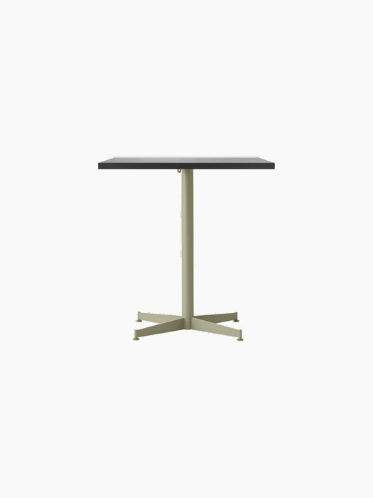 Front view of the Nook Dining Table, which has a rectangular charcoal-coloured top and a slim, olive-coloured four-star base.