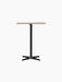 Front view of the Nook Counter Table with a rectangular Kunis Breccia stone tabletop and a black powder-coated steel base