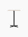 Front view of the Nook Counter Table with a rectangular Kunis Breccia stone top and a black steel base with four legs.