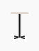 Front view of the Nook Bar Table with a light-coloured rectangular top and a slim black steel base with four legs.