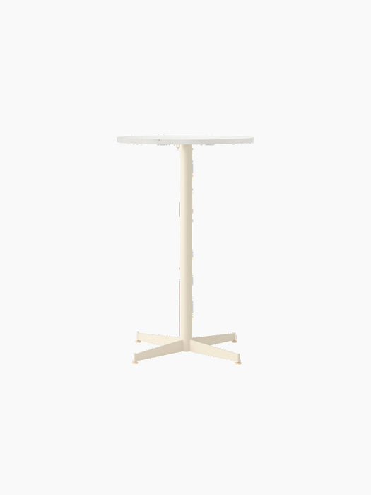 Front view of the Nook Counter Table, featuring a round Estremoz Marble tabletop and an ivory powder-coated steel base.