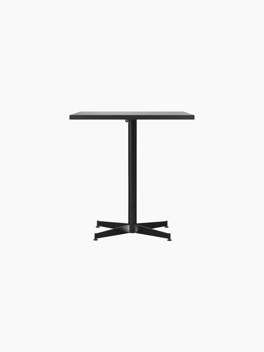 Front view of the Nook Dining Table with a rectangular stone tabletop and a slim, black powder-coated steel four-star base.