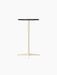 The Nook Bar Table with a round charcoal linoleum tabletop and a tall, ivory powder-coated steel base with four feet.