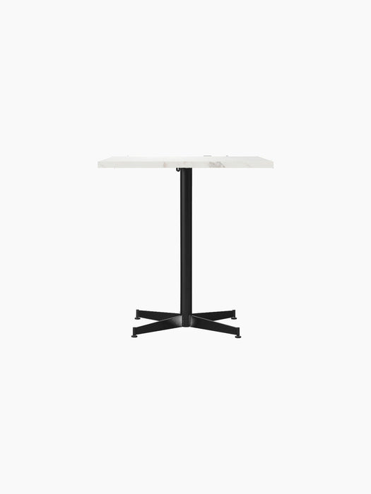 A front view of the Nook Dining Table featuring a rectangular white marble tabletop and a slim, black four-star metal base.