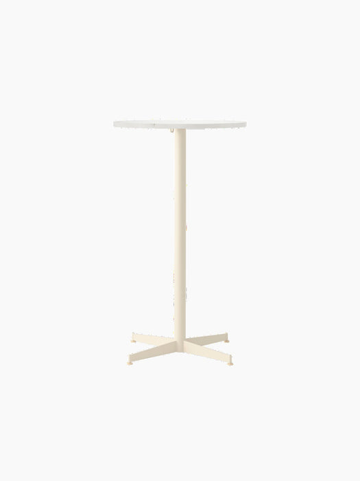 Front view of the Nook Bar Table, featuring a round Estremoz marble top on a tall, ivory powder-coated steel pedestal base.