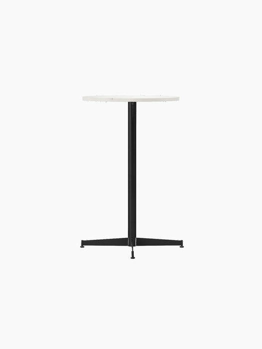 An angled view of the Nook Counter Table with a round white Estremoz marble top and black powder-coated steel pedestal base.