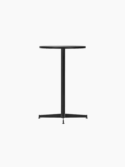 An angled view of the Nook Counter Table, featuring a round charcoal linoleum top and a slender black steel pedestal base.