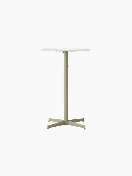 Front view of the Nook Counter Table with a round Estremoz marble top and an olive green four-pronged pedestal base.