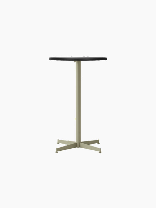 A front view of the Nook Counter Table, featuring a round, charcoal linoleum tabletop and a slender, olive-coloured base.