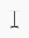 A front view of the Nook Counter Table, featuring a round Estremoz marble top on a slim, black pedestal base.