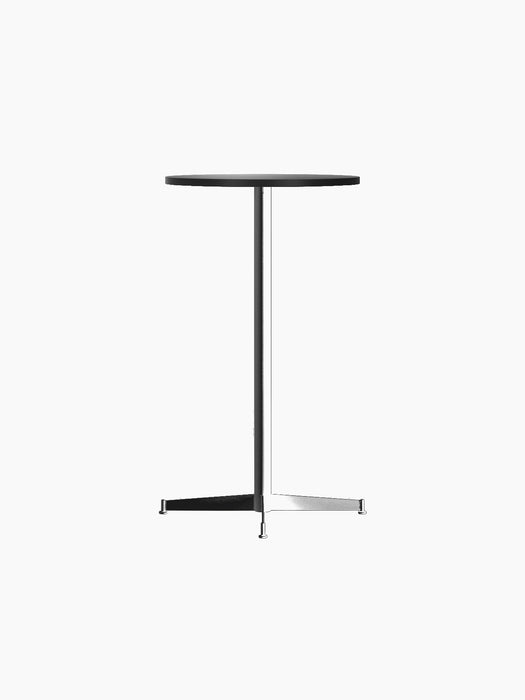 An angled view of the Nook Bar Table with a round charcoal linoleum top and a slender black steel base with four feet.